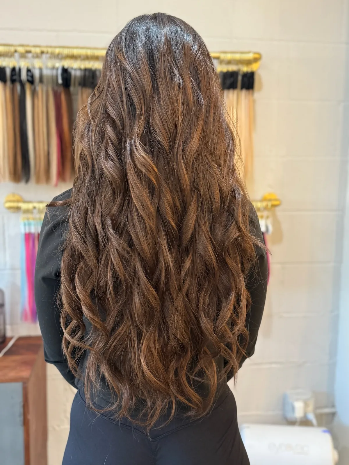 After: long brunette waves, full to the ends.