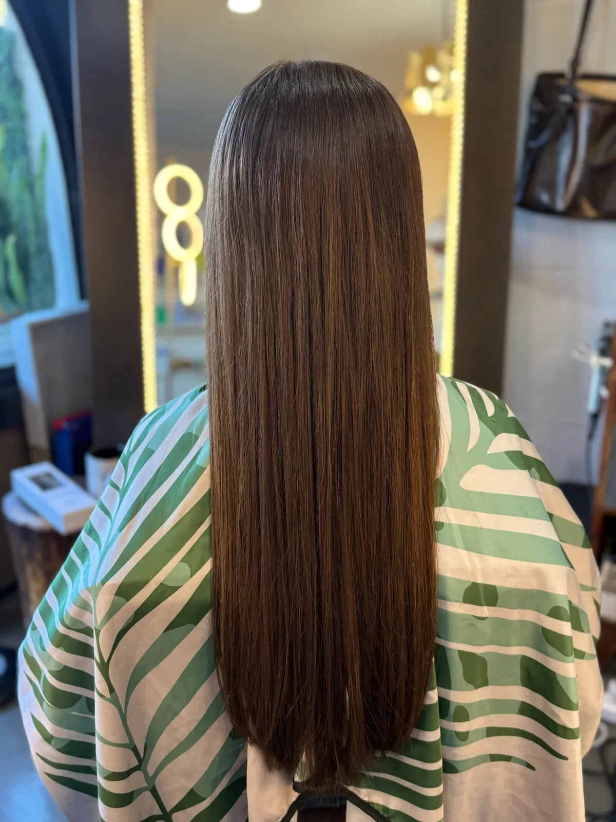 After: brunette hair with a full blunt finish.
