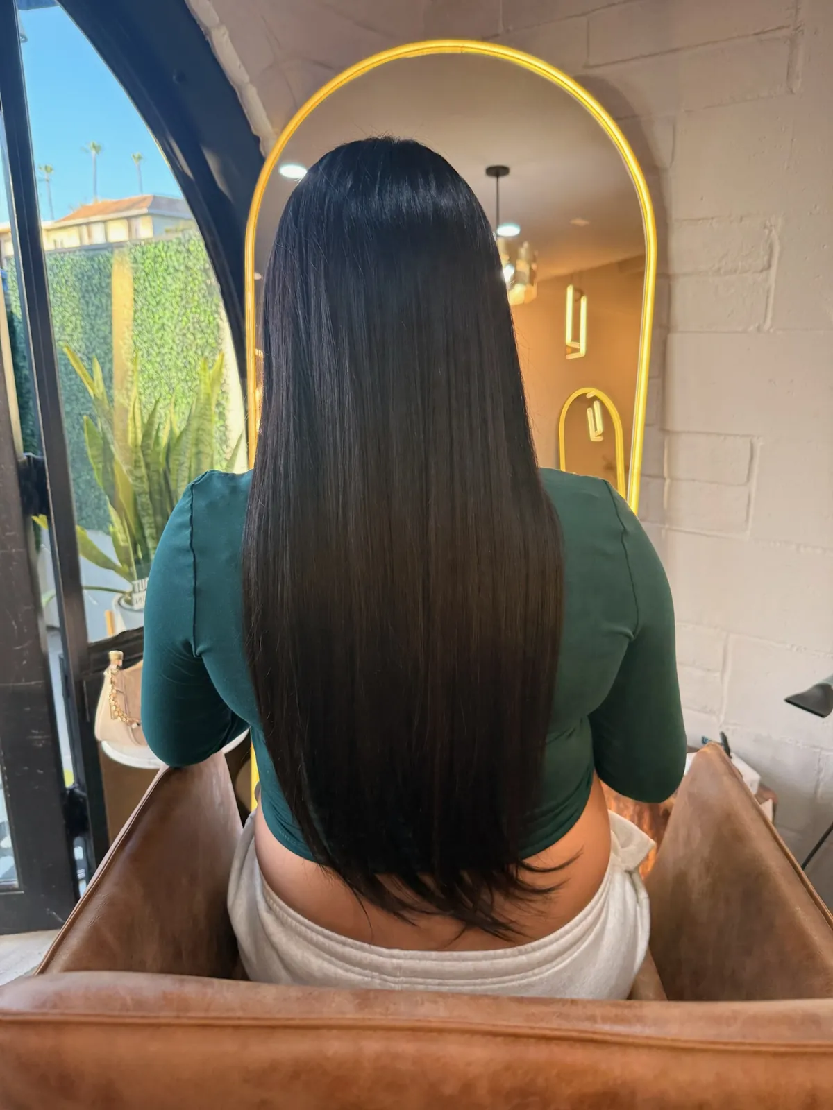 After: long sleek black hair.