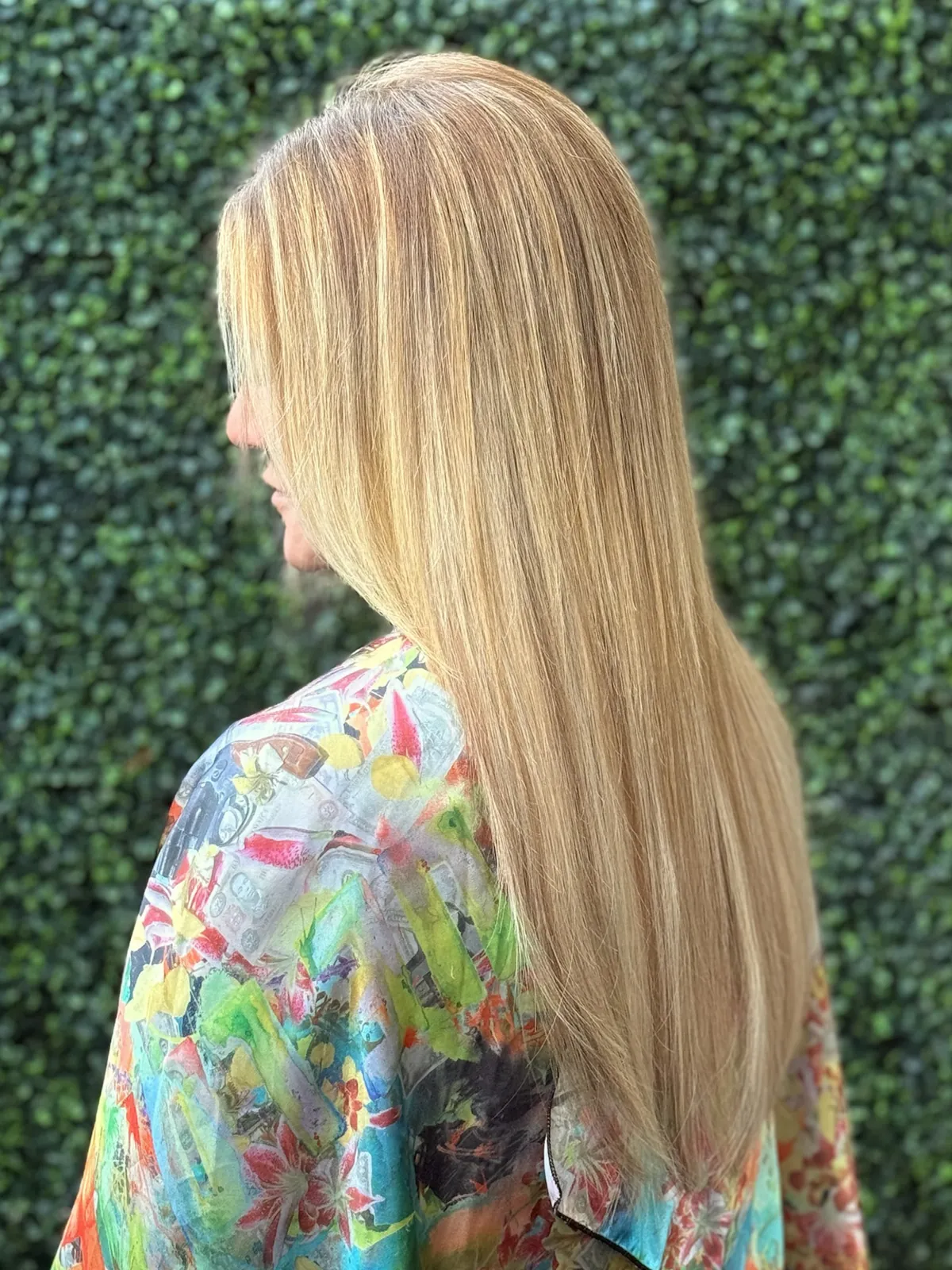 After: long straight blonde hair from the side.
